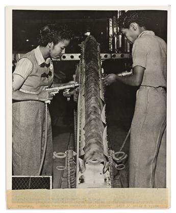 (MILITARY--WORLD WAR TWO.) 3 publicity photographs of women doing war-related factory work.